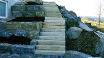 mit Steinen gepflasterte Treppe von Bergmann Galabau